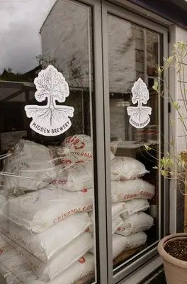 a display case filled with lots of white pillows at Seven Stars Penryn in Penryn