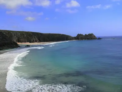 an aerial view of a beach with blue water at 1 Bed Cottage-Sleeps 3-Pool-Pets-near St Ives in Camborne