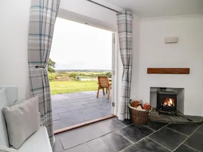 a view from a living room with a fireplace at Summercourt in Launceston