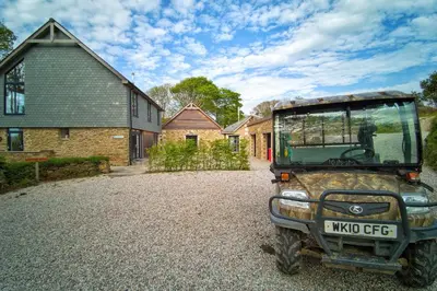 a jeep parked in front of a house at Glamping Yurts near Newquay in Newquay