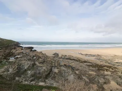 a view of a beach from a cliff at Newquay Fistral Beach View in Newquay