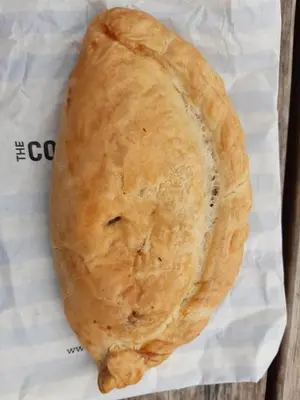 a loaf of bread sitting on a piece of paper at 67 Newquay Getaway in Porth