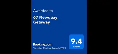 a close up of a cell phone with a blue screen at 67 Newquay Getaway in Porth