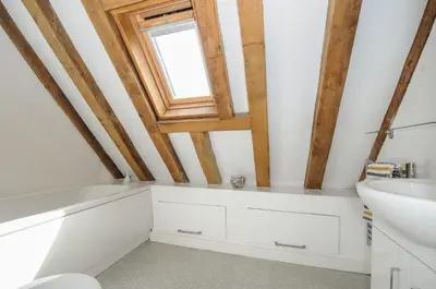 a bathroom with a sink and a window at Stow Cottage in Camelford