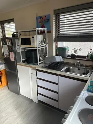 a small kitchen with a sink and a microwave at Ferney Croft in Saint Erth