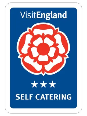 a blue sign with the vietlez island self catering logo at Cornish Holiday - 100 Hengar Manor in Bodmin