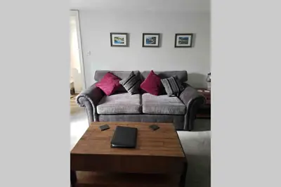 a living room with a couch and a coffee table at Beautiful Cottage in Central St Columb Major in Saint Columb Major