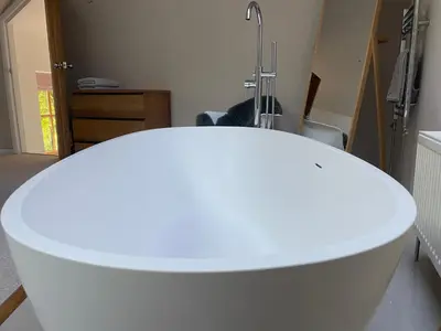 a white table in a room with a sink at Beautifully Converted Chapel in Blisland