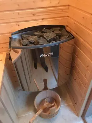 an inside view of a sauna with a fire pit at Beautifully Converted Chapel in Blisland
