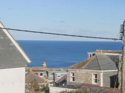 a view of the ocean from a house at The Beach Hut in St Ives