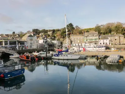 a group of boats are docked in a marina at Summer Breeze in Padstow