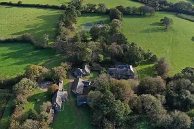 an aerial view of a house in a field at Boconnion Estate Sleeps up to 45 in Bodmin