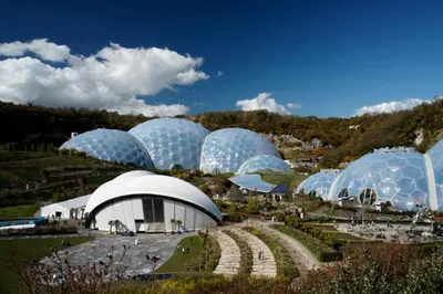 a group of domes in a field with a garden at Wheel Water Collections in St Austell