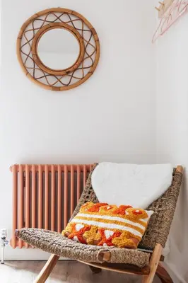 a wicker chair with a cake and a mirror at Stunning views over the beautiful Falmouth Harbour in Falmouth