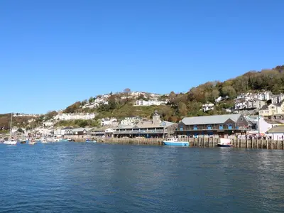 a group of boats are docked at a harbor at Blue Sky Cottage in Liskeard
