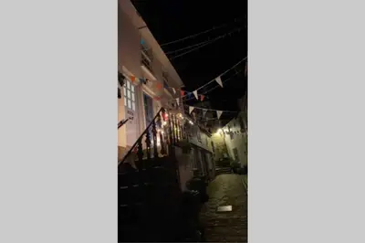 an alley way at night with clotheslines and lights at The Nest - St Ives in St Ives