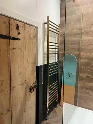 a door to a room with a skateboard next to it at The Nest - St Ives in St Ives
