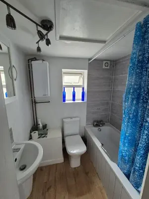 a bathroom with a toilet and a tub and a sink at Cottage in village of Mevagissey Cornwall Sleeps 4 in Mevagissey
