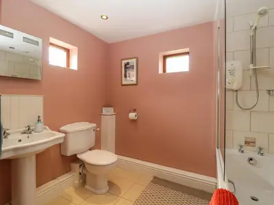 a bathroom with a toilet sink and a shower at Frogwell Chapel in Callington
