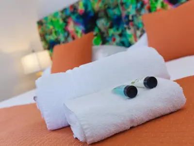 a rolled up towel with a roll of toilet paper at Sea Sands in Penzance