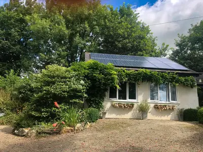 a house with solar panels on the roof at Primrose End in Bude