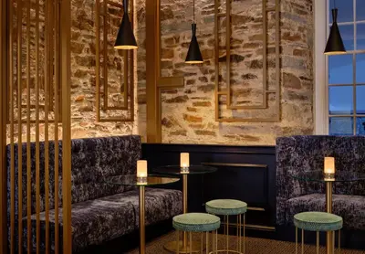 a restaurant with two tables and two chairs at Bodmin Jail Hotel in Bodmin
