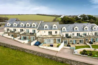 an aerial view of a row of houses at Apartment by the beach, sea views in St Merryn