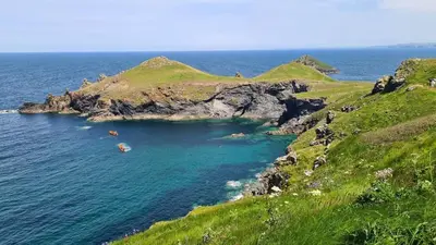 a small island in the ocean on a grassy hill at Detached Bungalow in North Cornwall in Bodmin