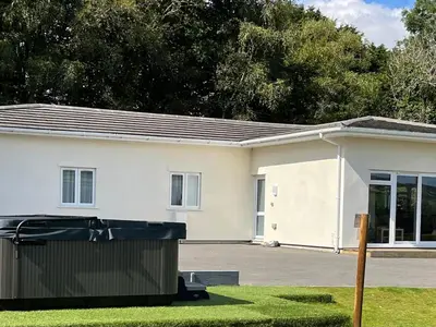 a house with a garbage can in front of it at Woodhall in Bodmin