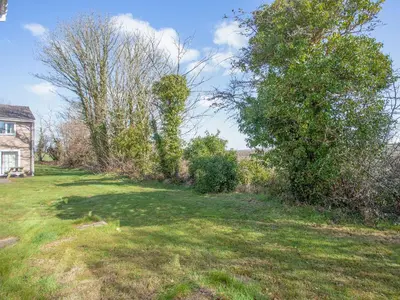 an empty yard with trees and a house at 117 Atlantic Reach-Uk32918 in Saint Columb Major