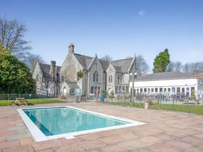 a house with a swimming pool in front of it at 117 Atlantic Reach-Uk32918 in Saint Columb Major
