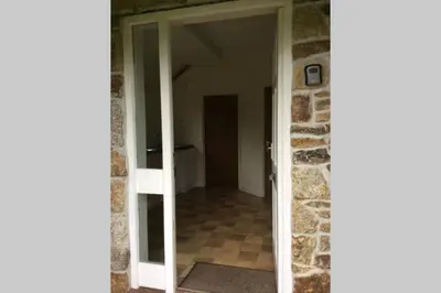 an open door into a room with a hallway at Okewoon Farm in Lanivet