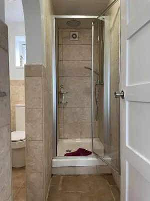 a shower with a glass door in a bathroom at 43 annexe in Newquay