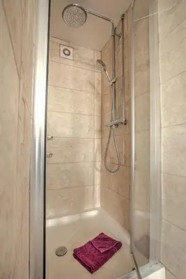 a bathroom with a shower with a bath tub at 43 annexe in Newquay