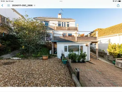 an image of a house with a driveway at 1 Bed Flat - Sleeps 2 - Pets - Balcony - Parking in Looe