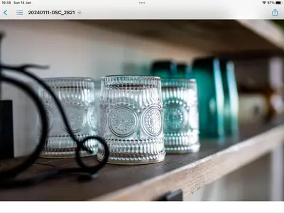 a row of glass cups sitting on a shelf at 1 Bed Flat - Sleeps 2 - Pets - Balcony - Parking in Looe
