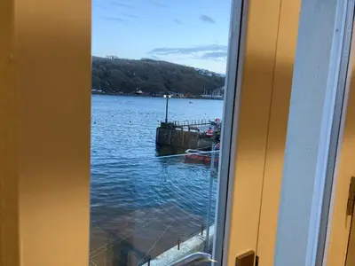a view of a body of water from a window at The Galleon Inn in Fowey