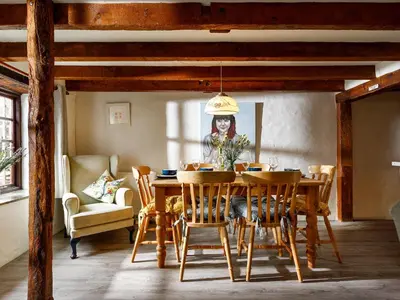 a dining room with a table and chairs at Little Leighs in Launceston