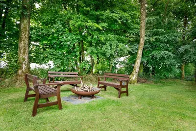 three park benches and a table and a fire hydrant at Little Leighs in Launceston