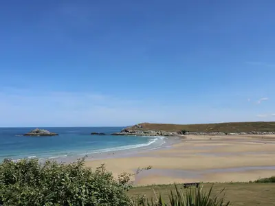a sandy beach with the ocean in the background at No 1 The Hinges in Newquay