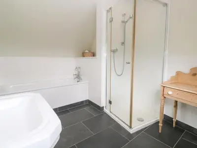 a bathroom with a shower and a toilet and a sink at No 3 The Hinges in Newquay