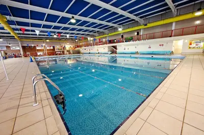 a large swimming pool in a large building at Newquay Bay Resort - SummerBreeze PV54 in Porth