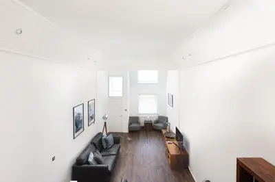 a living room with a couch and a table at Mr Blue Sky in St Ives