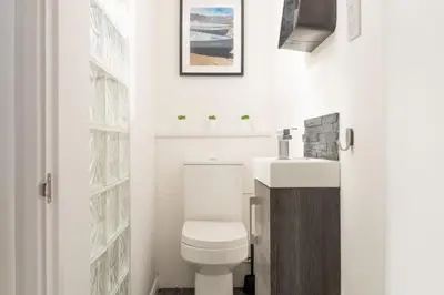 a bathroom with a toilet and a sink at Mr Blue Sky in St Ives