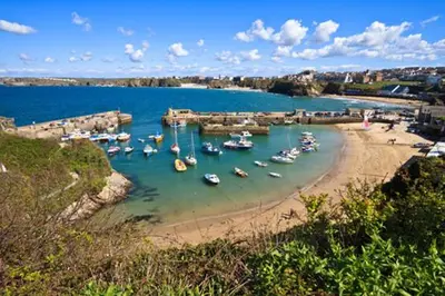 a group of boats in the water on a beach at The Town House - Newquay in Newquay
