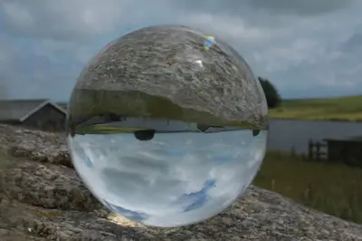 a glass ball with a reflection of the sky at 2-Bed Cottage Sleeps 5 Pets Ok Close to Coast in Davidstow