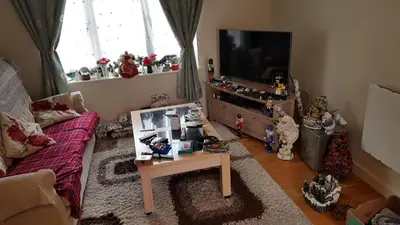 a living room with a couch and a tv at 2-Bed Cottage Sleeps 5 Pets Ok Close to Coast in Davidstow