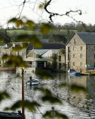 a body of water with boats in it at The Dog House, Penryn in Penryn