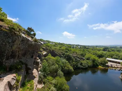 a view of a river from a cliff at Mellydonen Beder Del Melly, Tor Down Quarry in Bodmin