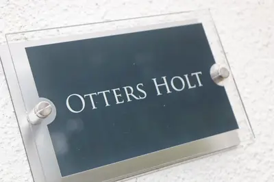 a sign that reads offershut hanging on a wall at Otters Holt in St Merryn